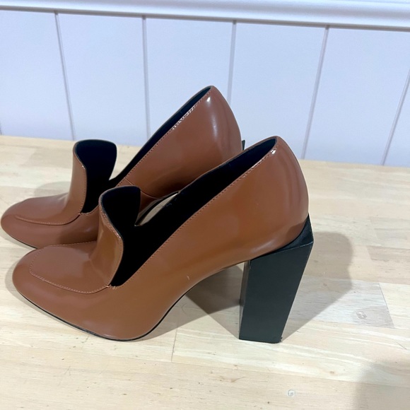 Brown heel shoes with cool square heel. Worn a few times but in good condition!